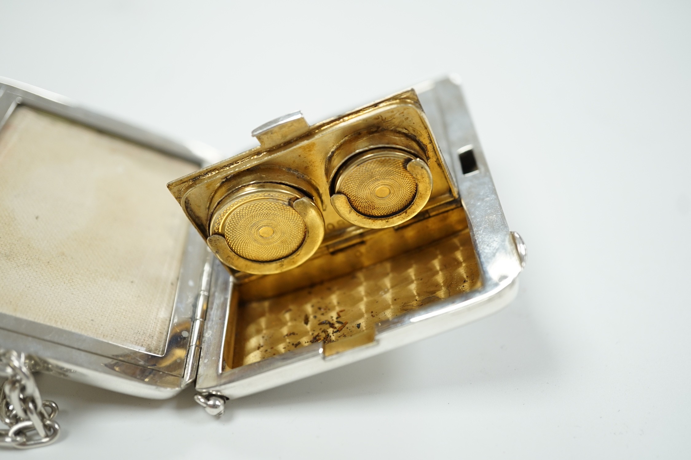 An early 20th century American engraved sterling rounded rectangular combination aide memoir, purse, pill box, sovereign and half sovereign case, by R. Blackinton & Co, with pencil and suspension chain, 88mm.